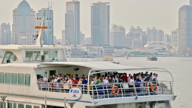 A crowded ferry to Pudong on the opposite bank.
